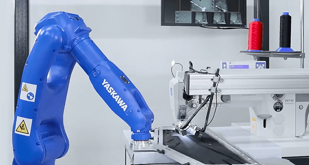This is a photo showing a robotic sewing system completing an automatic sewing task.