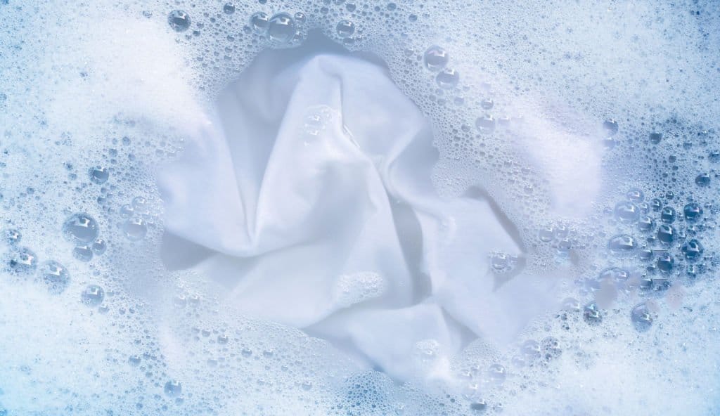 Top view of soak a cloth before washing, white cloth