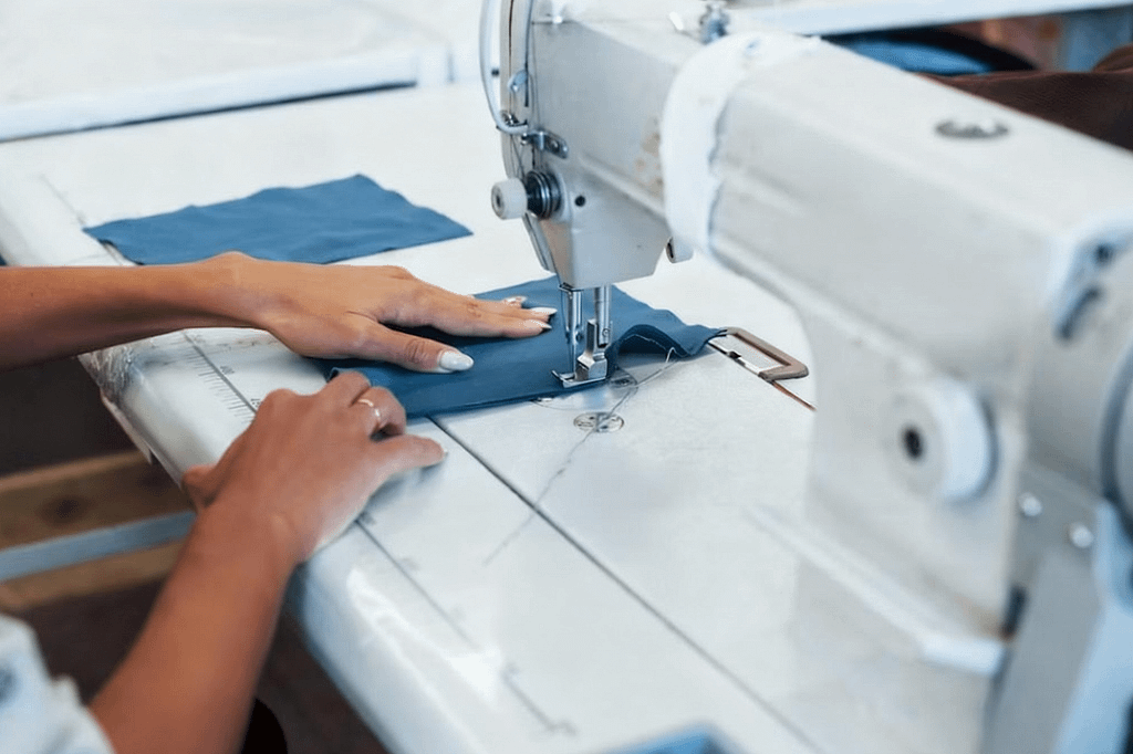 Clothing manufacturers are making clothes.