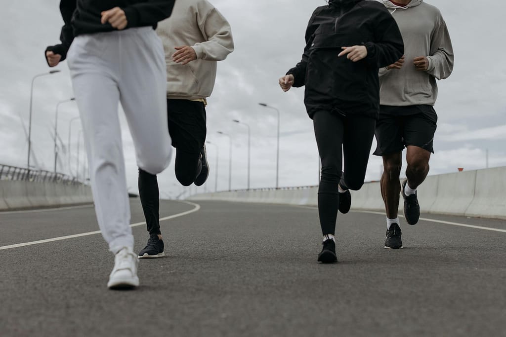Several runners wearing leggings and jogging pants