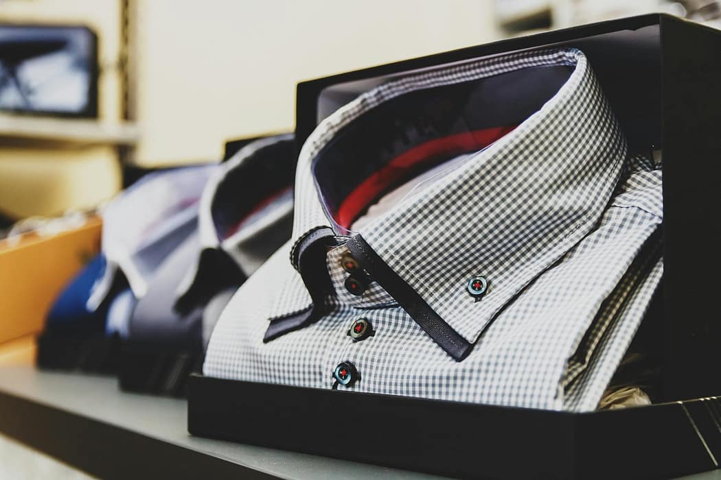 Two premium shirts on display in the store