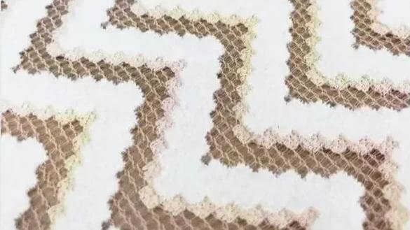 A type of lace fabric known as Chenille Lace.