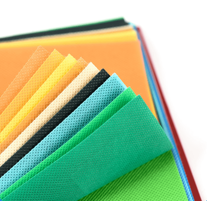 Polypropylene non-woven fabrics in different colors on the tabletop