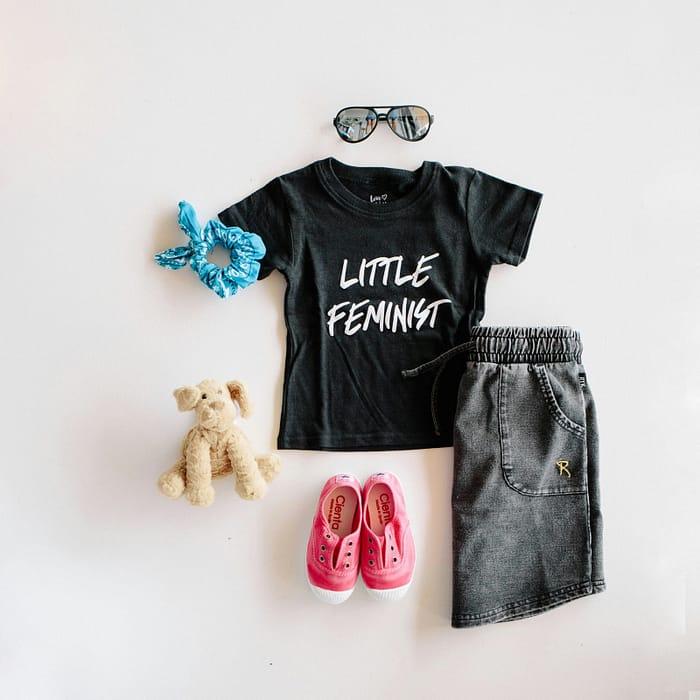 Children's clothing and shoes on a whiteboard