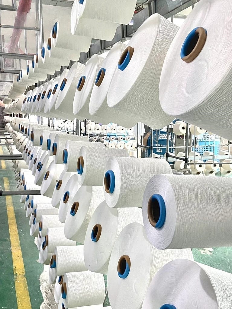 This is a step in the production process of PBT fabrics - blank weaving, the picture is a variety of cylinder yarns