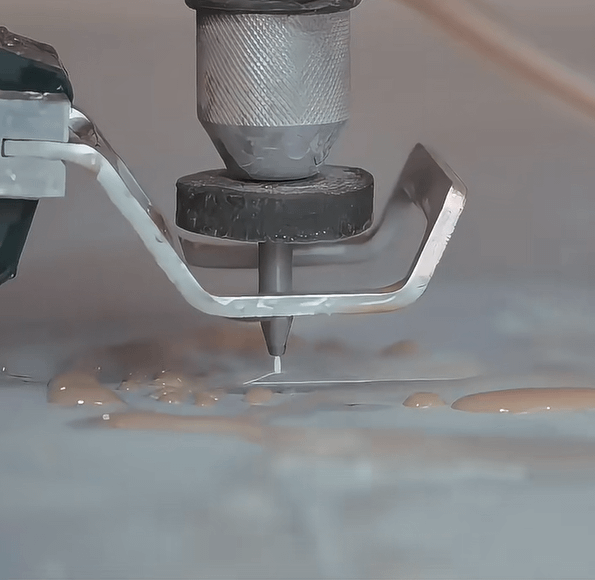 This is a picture of a high pressure water jet cutting machine cutting cloth