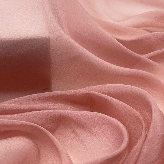 Detailed view of fabric of silk organza, one of the types of organza fabrics.