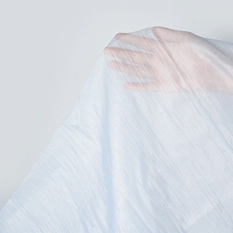 Detailed view of fabric of Crushed or Textured Organza, one of the types of organza fabrics.