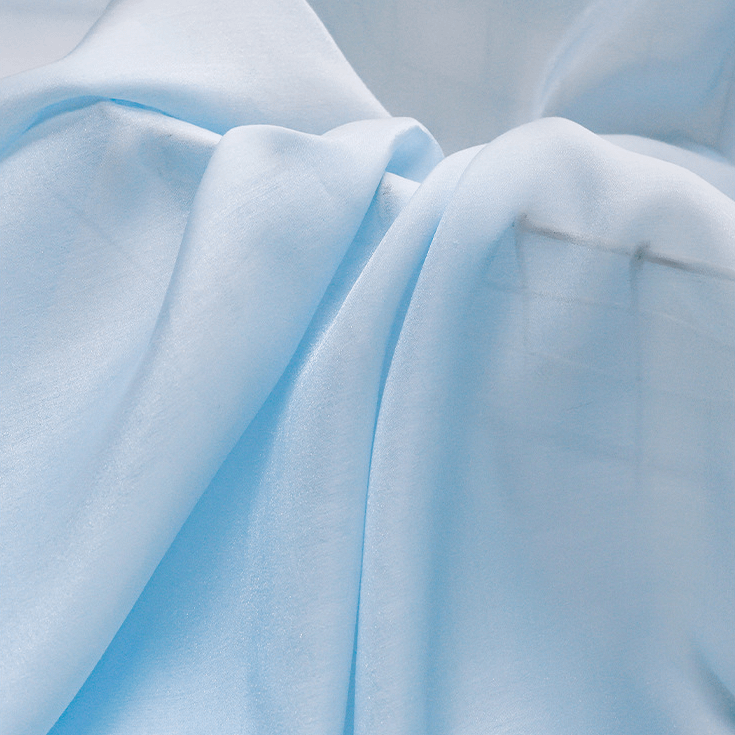 Detailed view of fabric of Polyester Organza, one of the types of organza fabrics.
