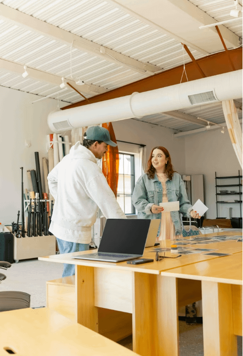 Two staff members are discussing external and operating costs.