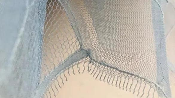 A type of lace fabric known as Eyelash Lace.