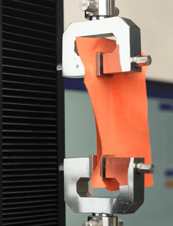 Testing fabric stretchability using machinery